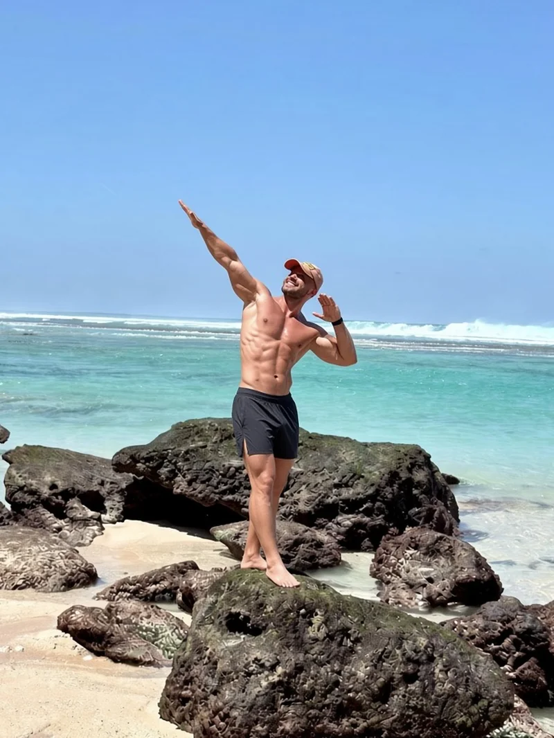 Maxim Lagoshin on the ocean rocks in Bali